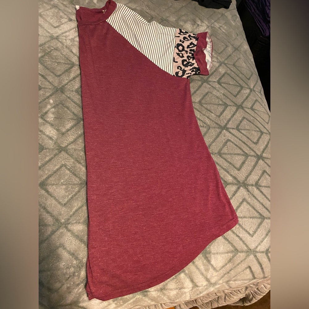 Like new. Burgundy shirt with striping and leopard details.